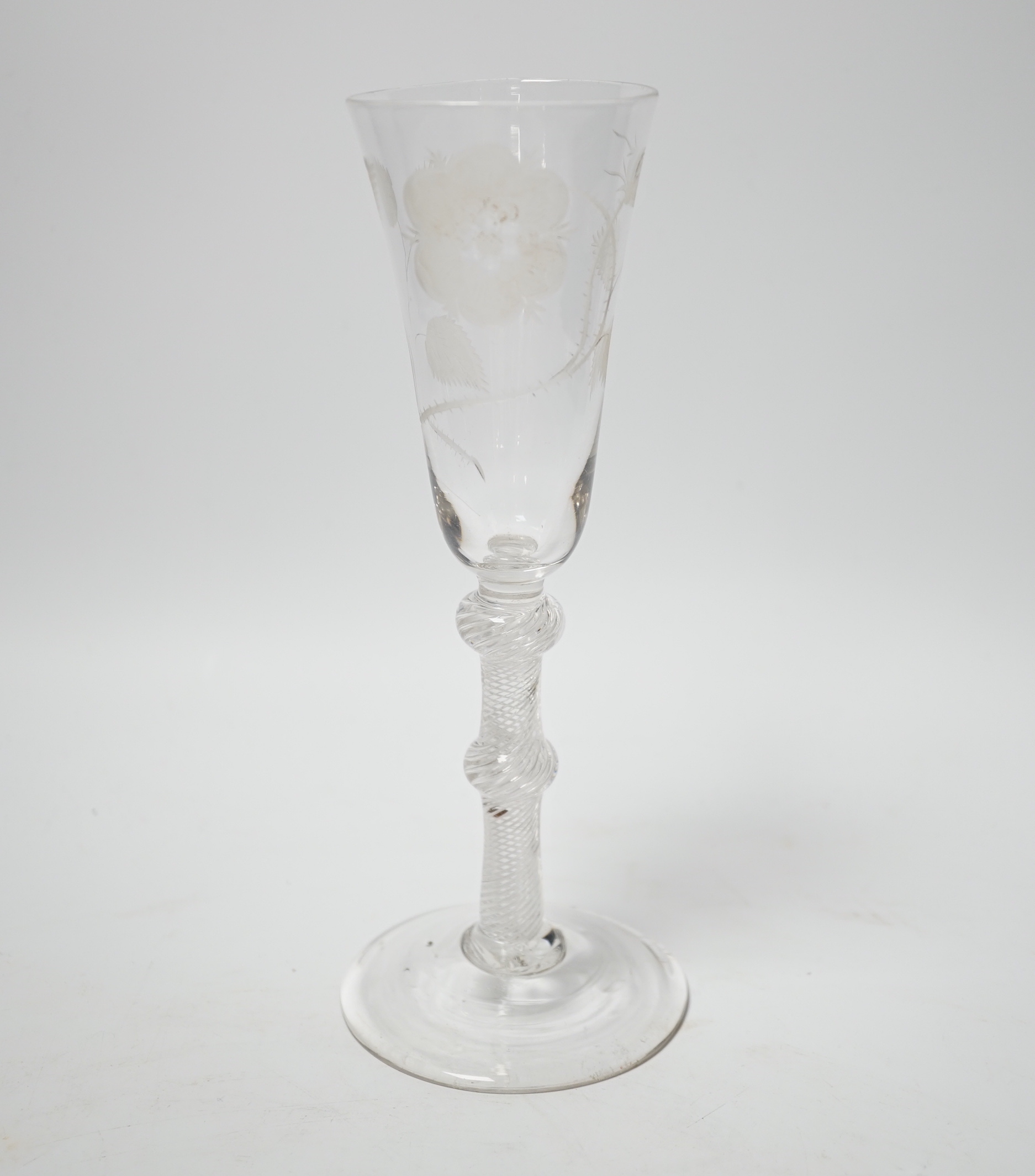 An 18th century Jacobite ale glass with double knop and air twist stem, engraved with a rose, 20.5cm